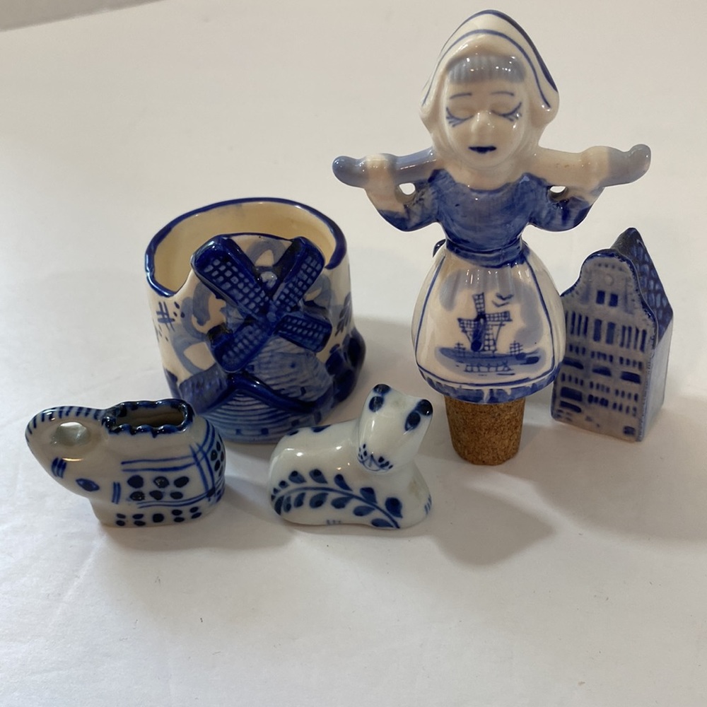 Lot of delft blue figures including rare bottle stopper.